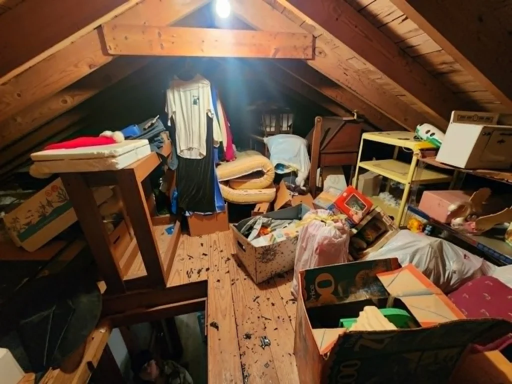 Before photo of an attic cleanout in Pulaski, TN with unwanted items and clutter before removal