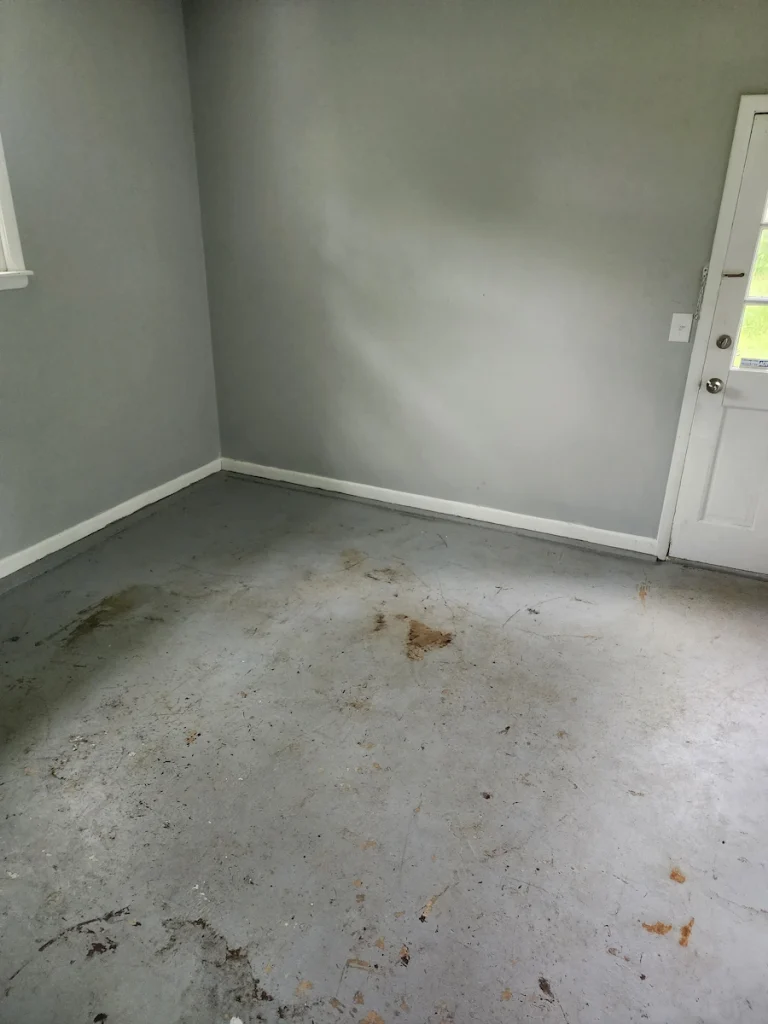 After photo of a foreclosure garage cleared after junk removal