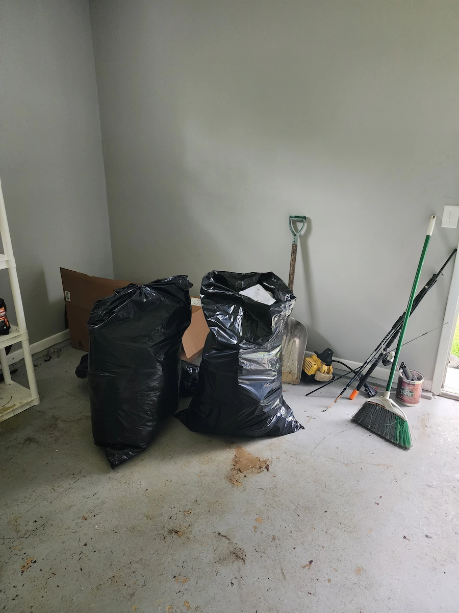 Before photo of a foreclosure garage cleanout before junk removal