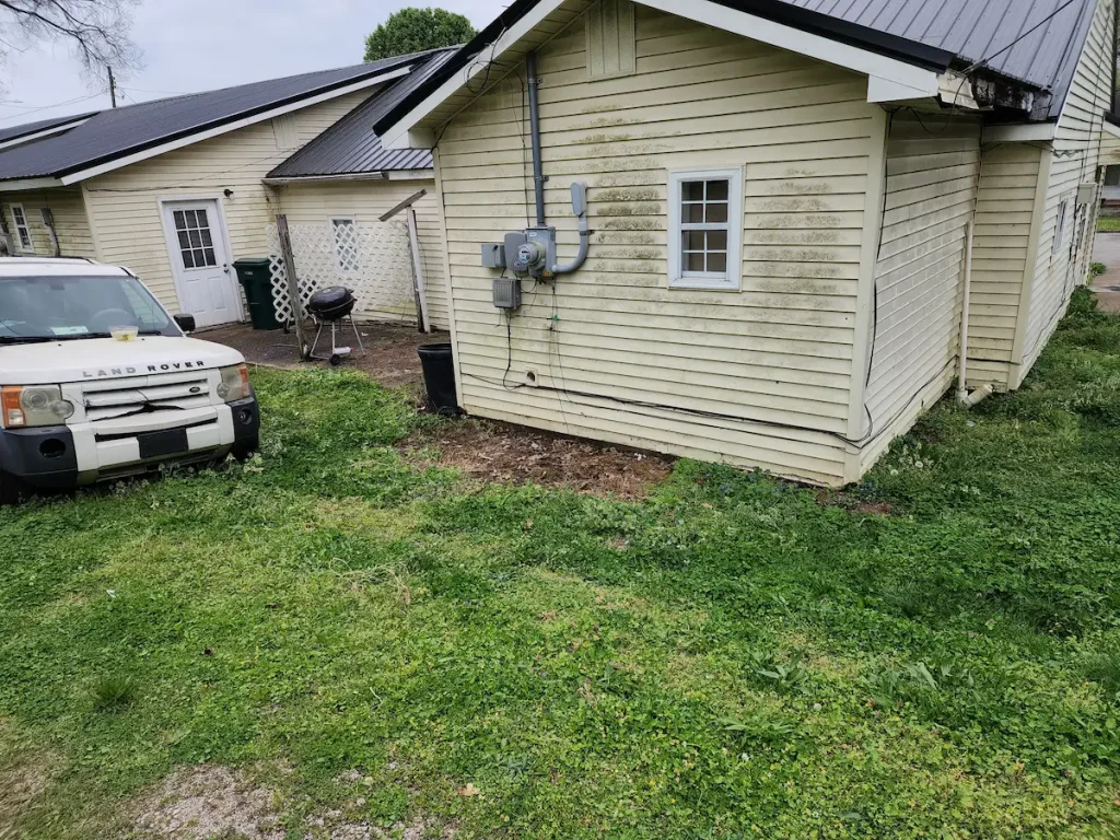 After photo of a rental property patio cleanup in Pulaski, TN showing the area cleared