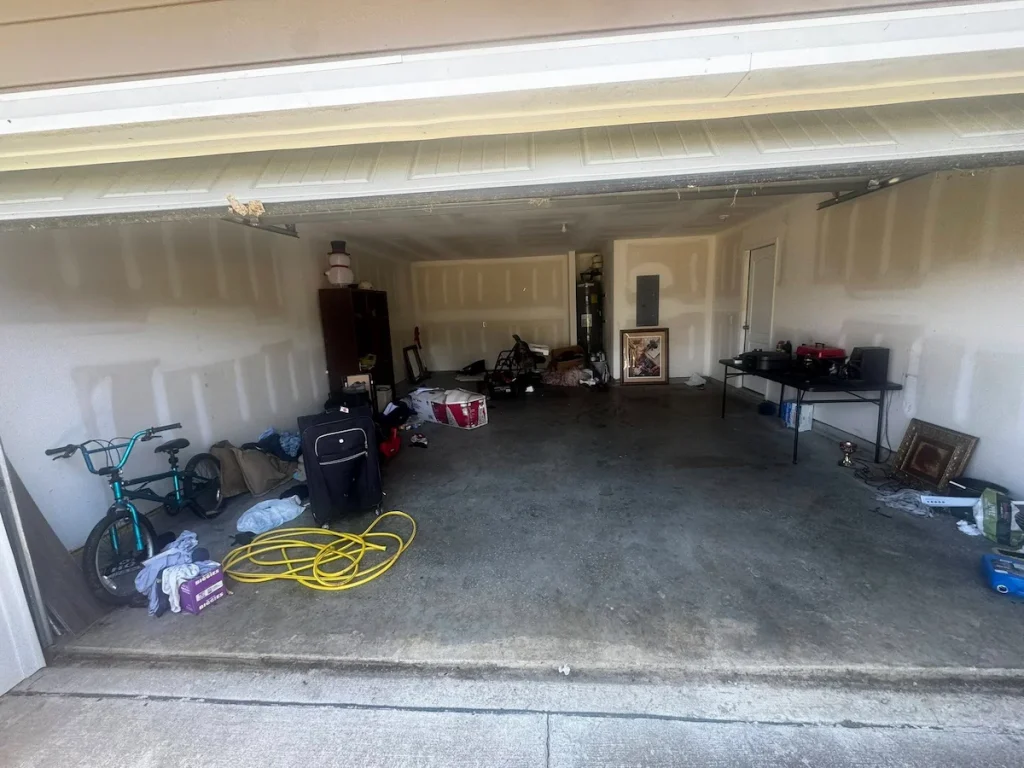 Before photo of a foreclosure garage cleanout in Columbia, TN