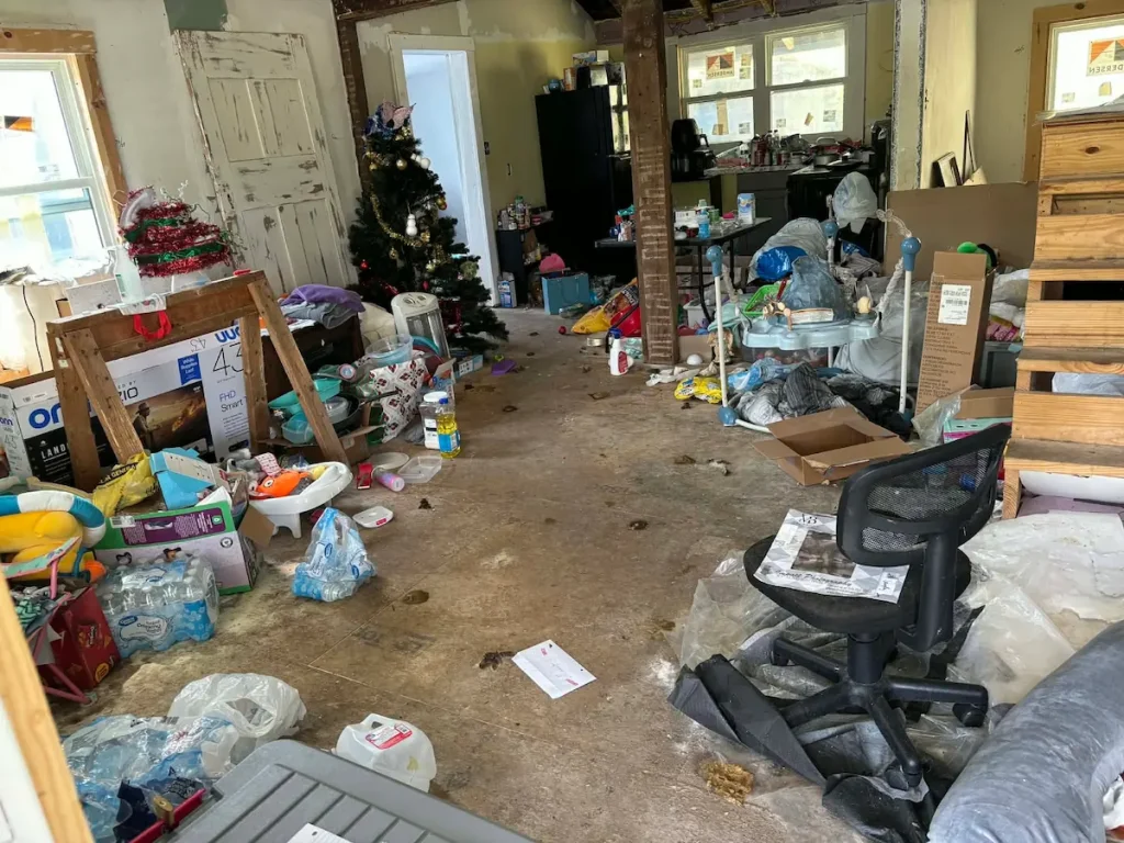 Before photo of a rental property cleanout in Ethridge, TN with trash and debris before removal